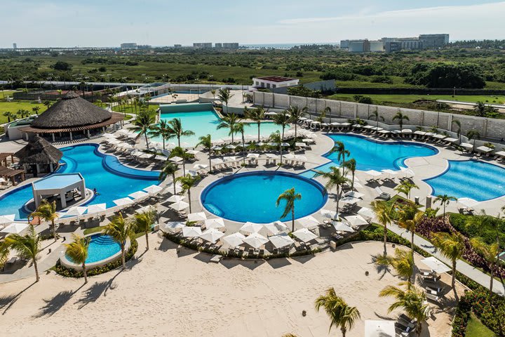 The hotel features six pools