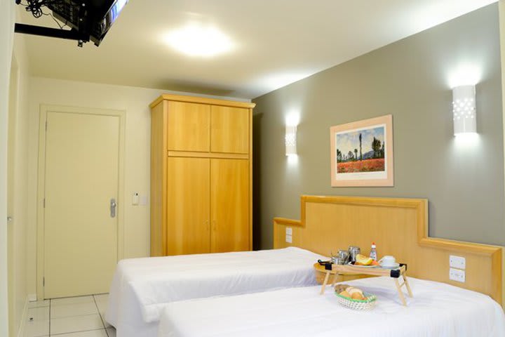 Guest room at Hotel Coral Tower Express with two beds