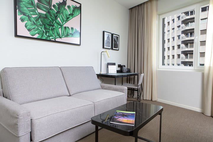 A sofa in a deluxe superior king guest room