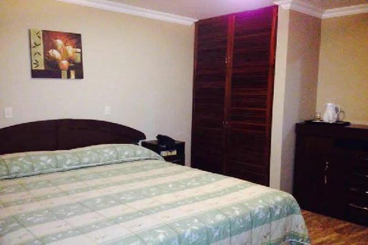 Bed and closet in a guest room