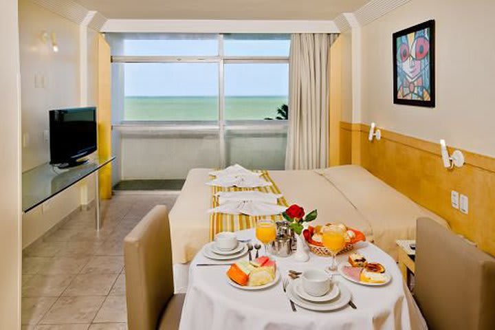 Guest rooms at Hotel Jangadeiro in Recife offer view to the sea