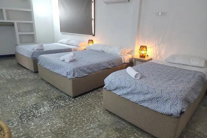 Room with 3 beds