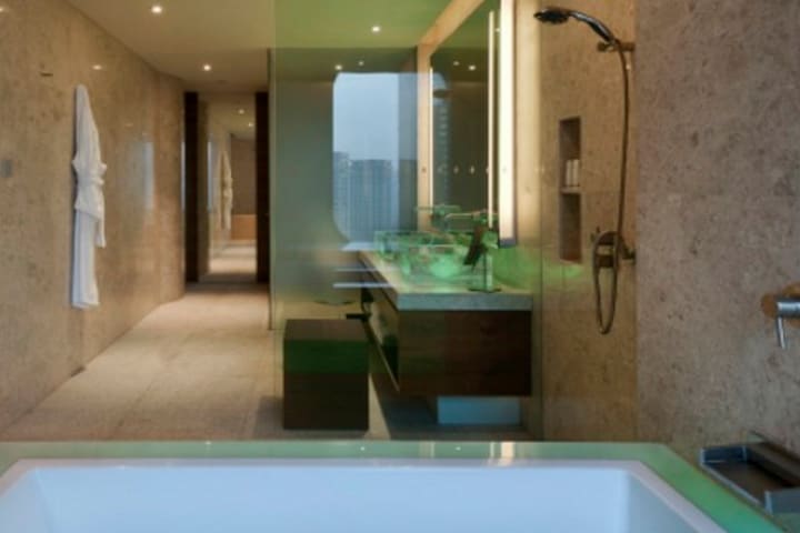 Bath with tub in a guest room at the Andaz Shanghai hotel