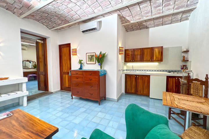 Sitting area and kitchen of an Oasis guest room