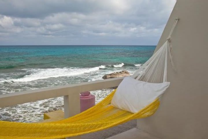 Terrace with hammock at Hotel Rocamar