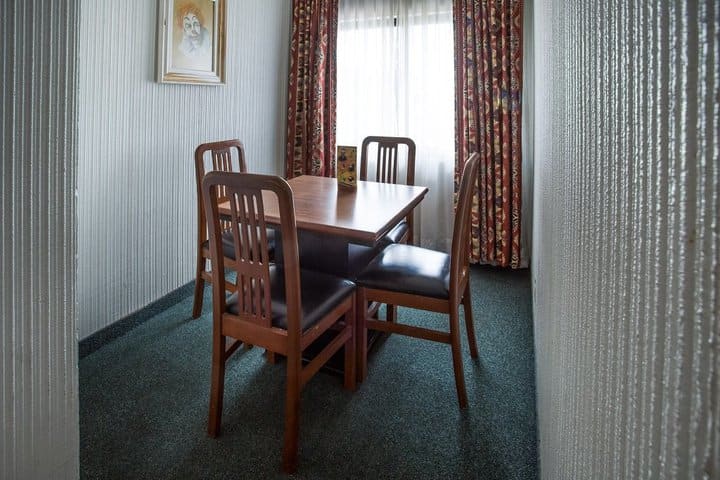 Table and chairs in the double suite