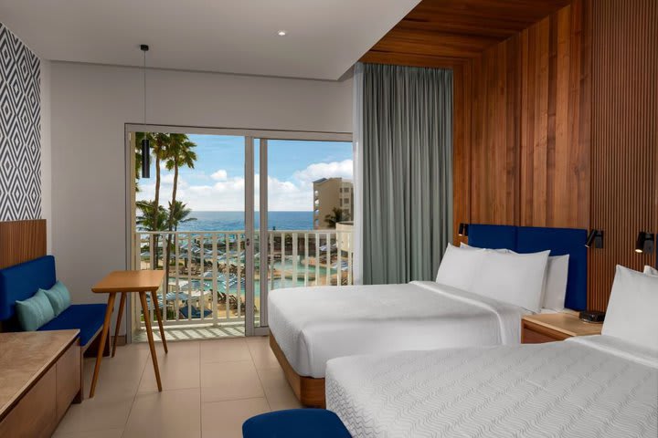 Guest room with two beds and Juliet-style balcony