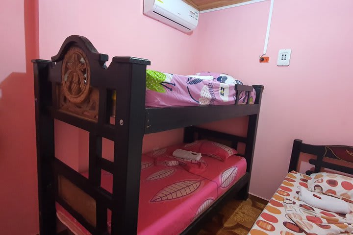 Cama en dormitorio compartido 3 personas