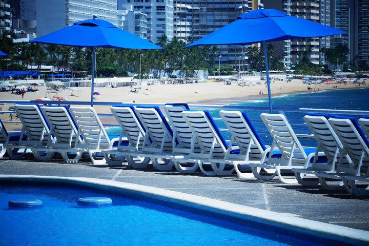 Sun loungers next to the pool