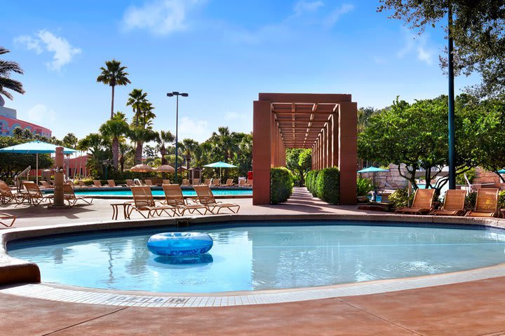 One of the pools has a waterfall and a slide