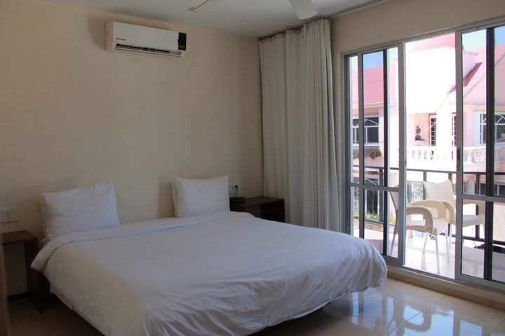 Guest room with a king size bed at Cabañas María del Mar hotel