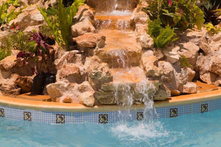 Fountain in the pool at the Hacienda Kaan Ac hotel