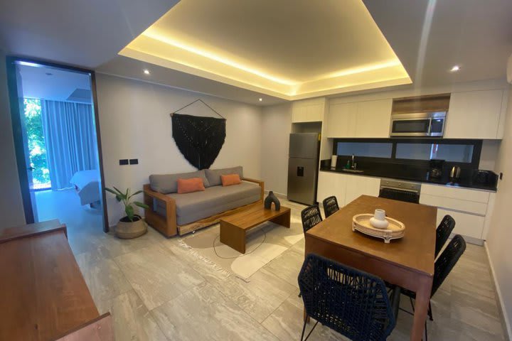 Sitting area, dinning area, and kitchen in a superior apartment