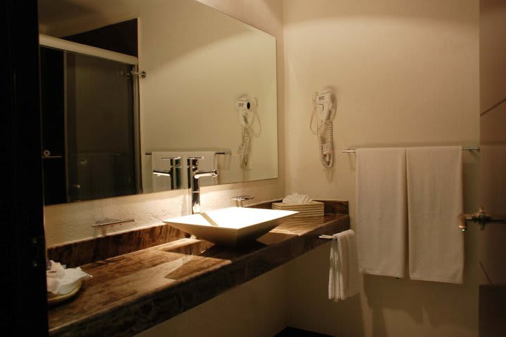 Guest bathrooms are modern and include a hairdryer