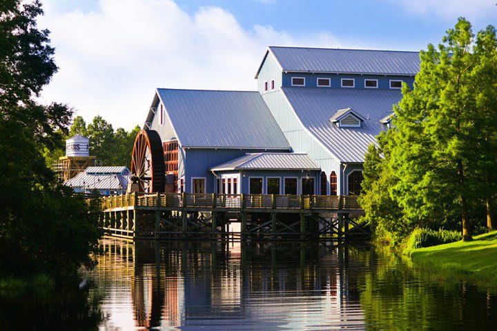 There is a water mill that houses an area with six food stations