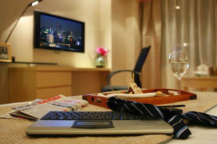 Guest rooms at the Jin Jiang Tower hotel offer LCD TV