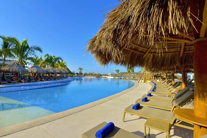 Pool with sitting area and sun loungers