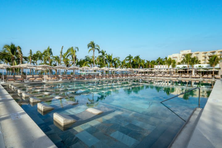 Sun loungers next to one of the pools