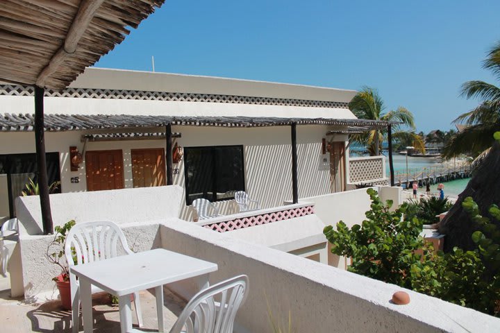 Table and chairs in a balcony of the hotel Villa Kiin