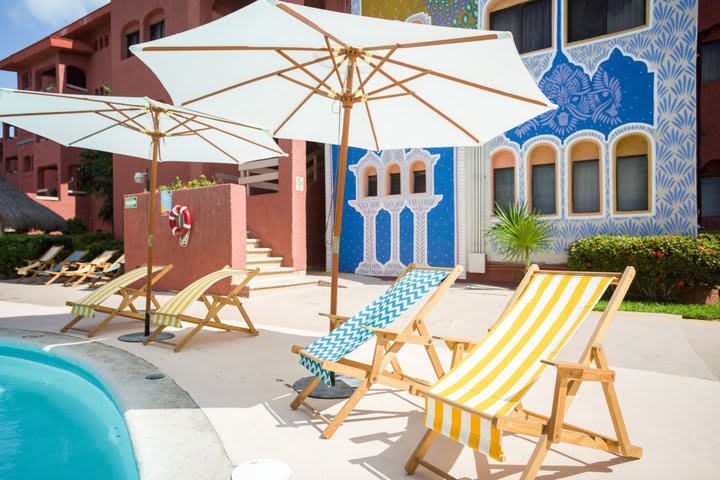 Sun loungers next to the pool