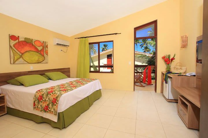 Bedroom in a deluxe guest room at the Porto de Galinhas Praia Hotel in Pernambuco
