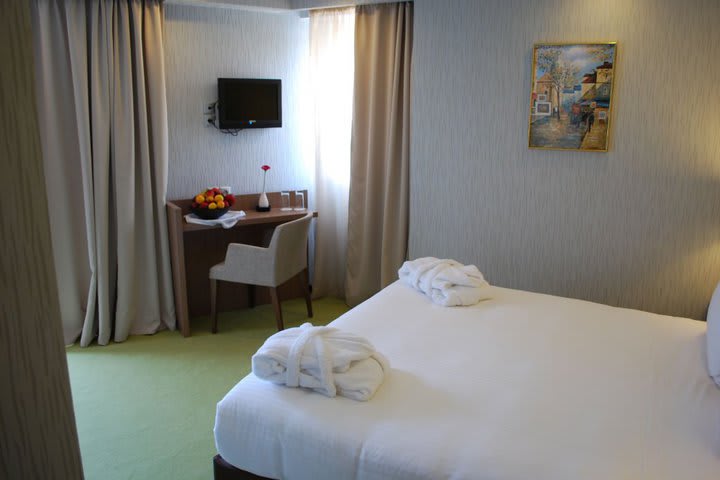 Guest rooms at the Athens Lotus Hotel have LCD TV