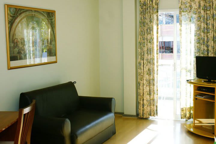 Sitting area in a guest room with ocean partial view at Hotel Sol da Barra 880