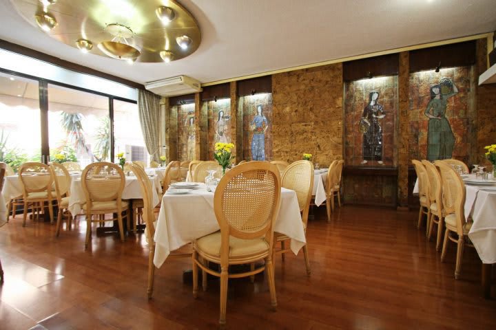 Table and chairs in the restaurant at the Ionis hotel in downtown Athens