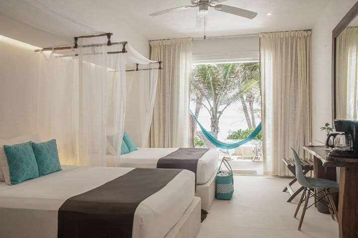 Beachfront guest room with 2 queen size beds