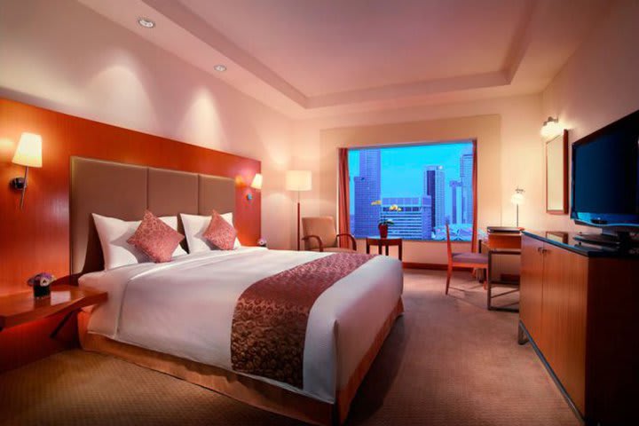 Guest room overlooking Singapore at the Carlton Hotel