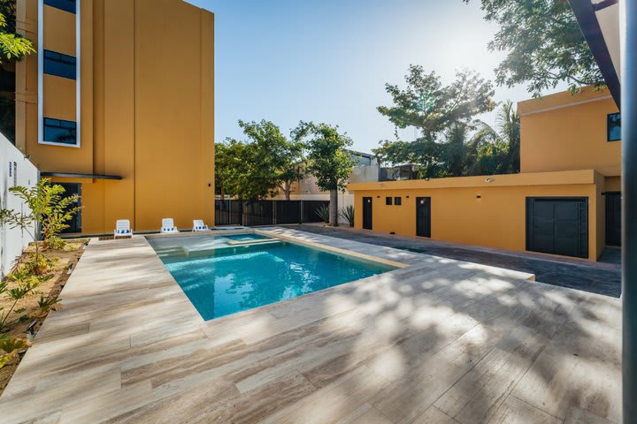 Sun loungers next to the pool