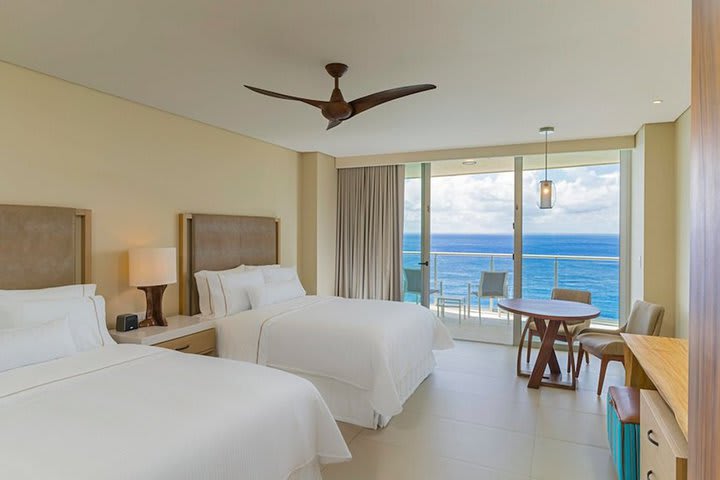 Classic guest room with two beds and balcony