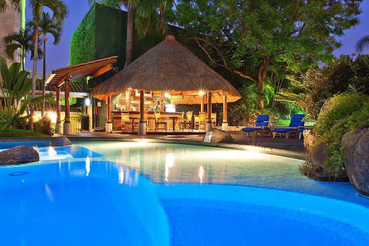 Night view of the bar and the pool