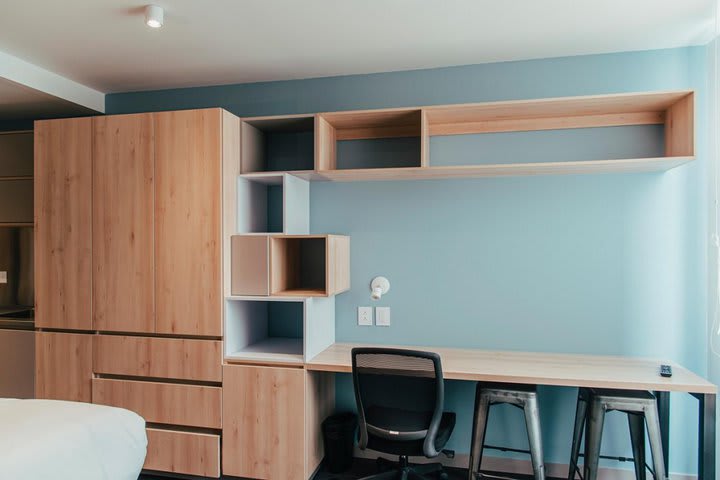 Work desk and closet in a Premium apartment studio