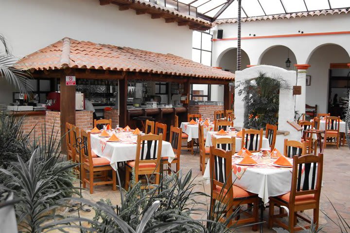 The restaurant at Plaza Magnolias hotel is in the interior patio