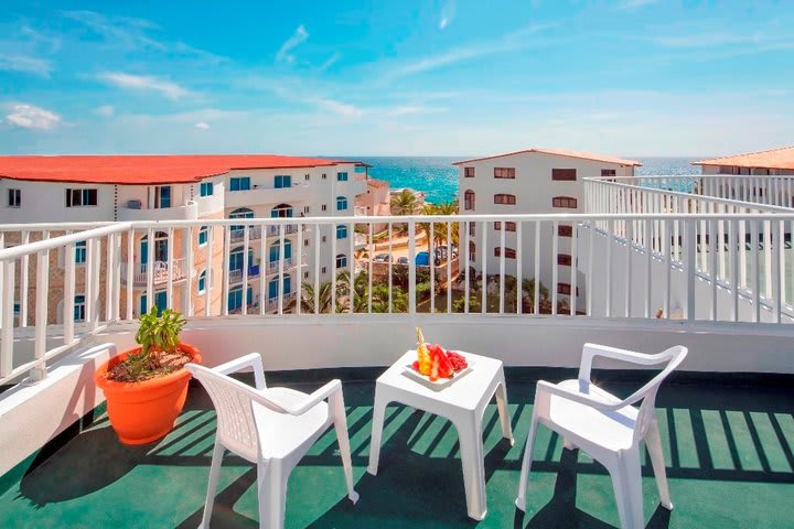 Balcony of a double guest room with partial ocean view