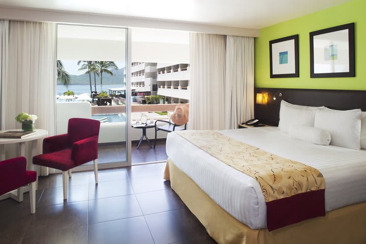 Room with balcony and pool view