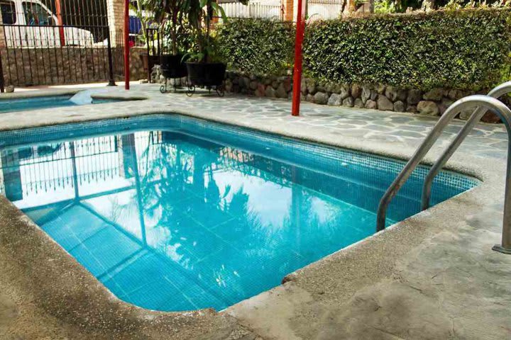 The hotel has a pool and gardened areas