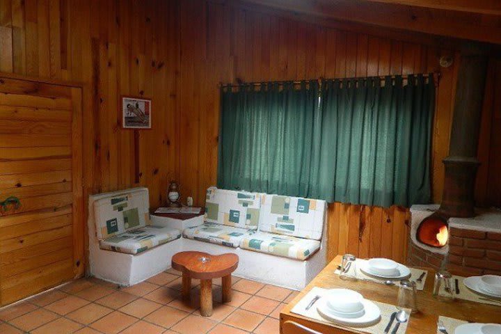 Dining and sitting areas in a traditional cabin