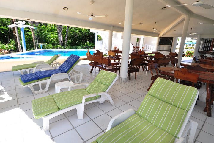 The hotel has a sitting area next to the pool