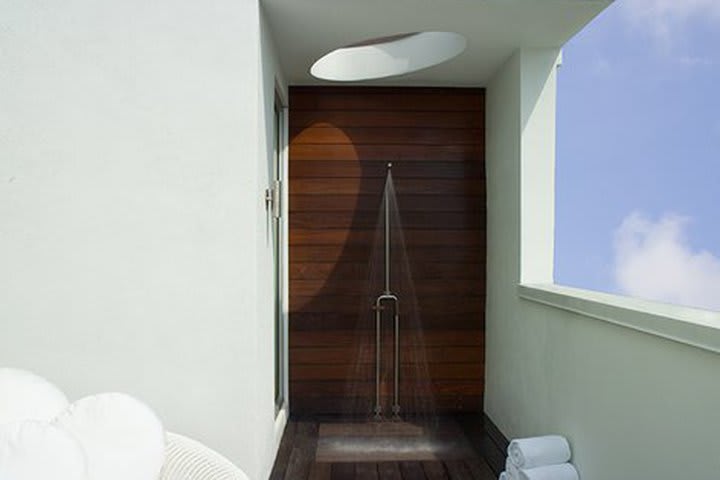 Outdoor shower on the terrace of a duplex suite at Dream South Beach