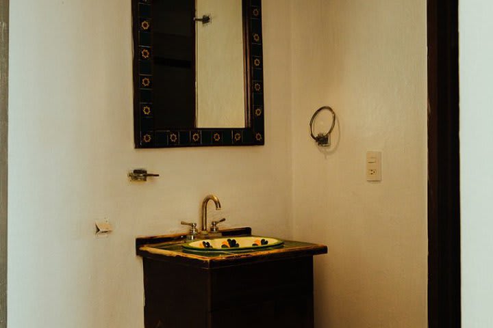 Bathroom of a deluxe guest room with two beds