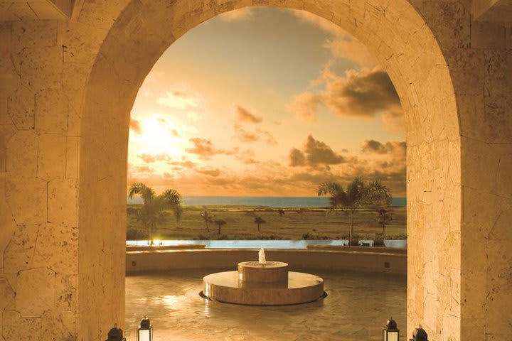 Interior passage at the resort overlooking the pool and the sea