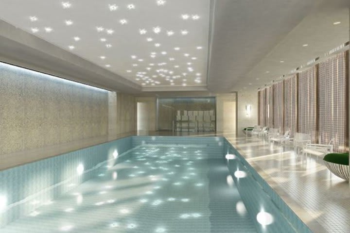 Indoor pool with sun loungers in the Spa at The Langham, Chicago hotel