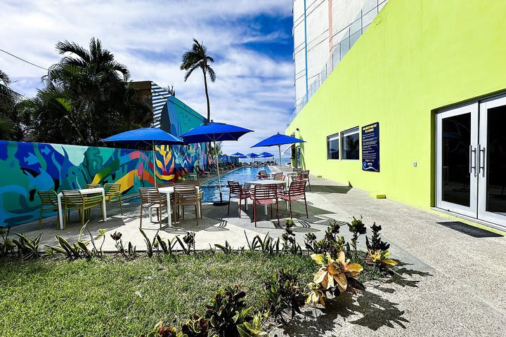 Tables next to the pool