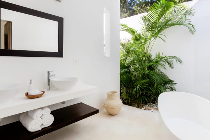 Private bathroom with tub and shower in a king suite