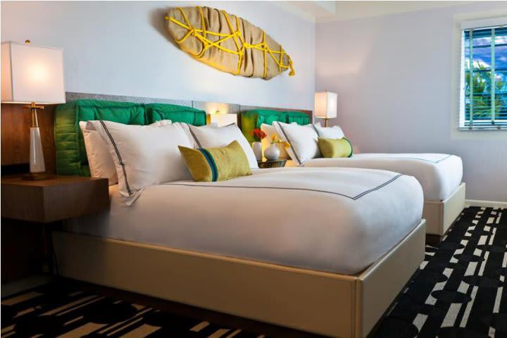 Guest room with two queen size beds at Surfcomber, a Kimpton Hotel