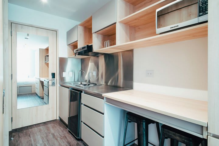 Equipped kitchen in a standard apartment studio