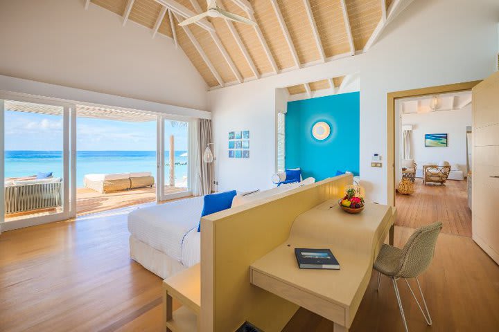 Bedroom of a family villa with direct access to the beach