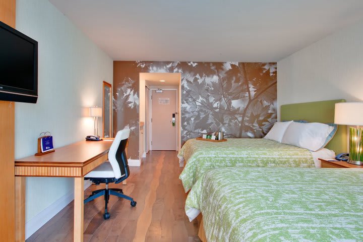 Guest room with two queen beds at Hotel Indigo Toronto Airport